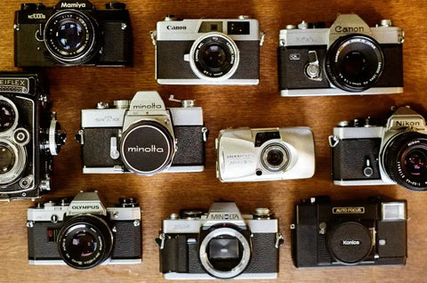 Collection appareils photo argentiques Canon Minolta Nikon Olympus Konica Mamiya Rolleiflex – Boutique atelier Lyon France